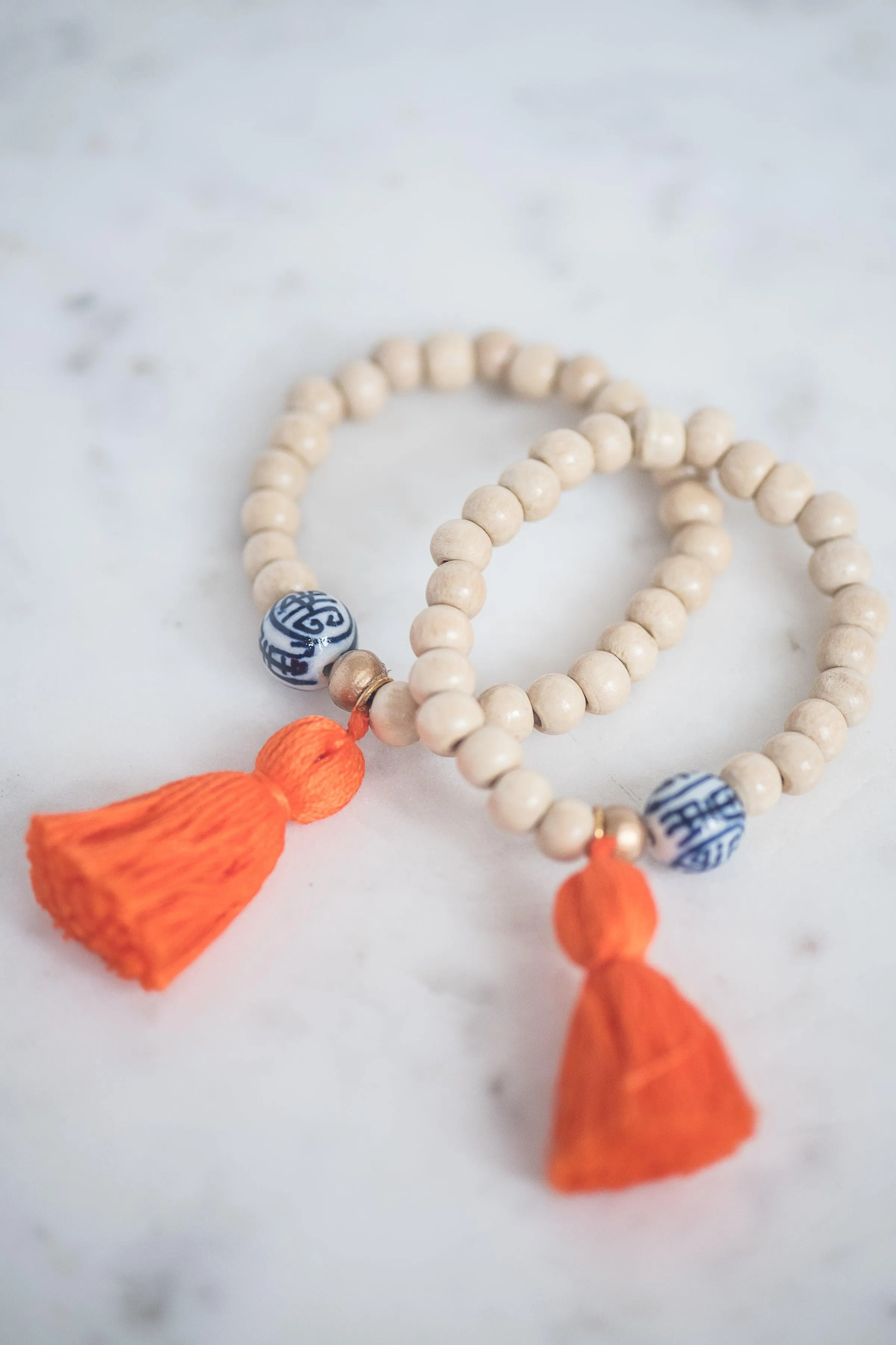 The Elliotborough Tassel Bracelet In Orange